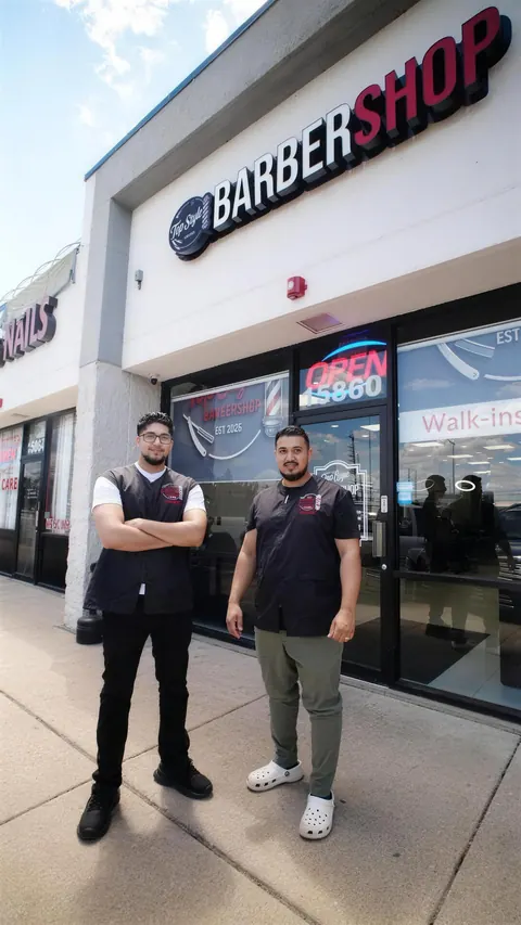 Two of the Top Style team standing outside the shop on Wolf Rd